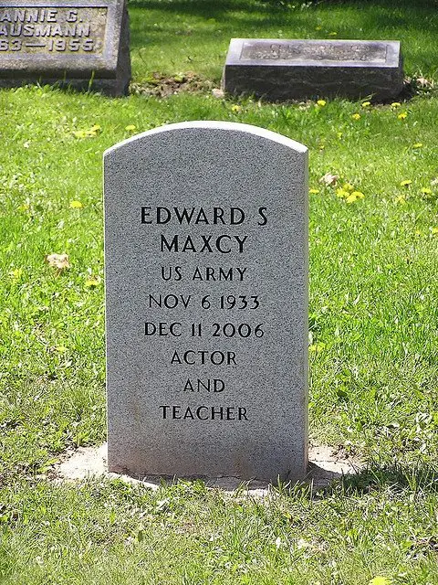 This is a standard government headstone with an unusual ...